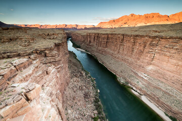Dramatic View of a River Winding Through a Deep Desert Canyon © Cavan