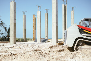 Naklejka premium Concrete columns and machinery at Anna Maria Island build site