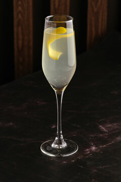alcoholic cocktail with lemon juice on the bar table