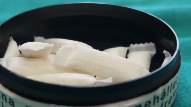 nicotine pouches close up in container white snus product macro