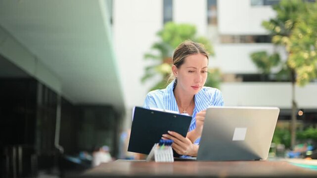 Stressed business woman working on laptop, talking on phone. Remote work pressure, deadline, burnout, anxiety, multitasking