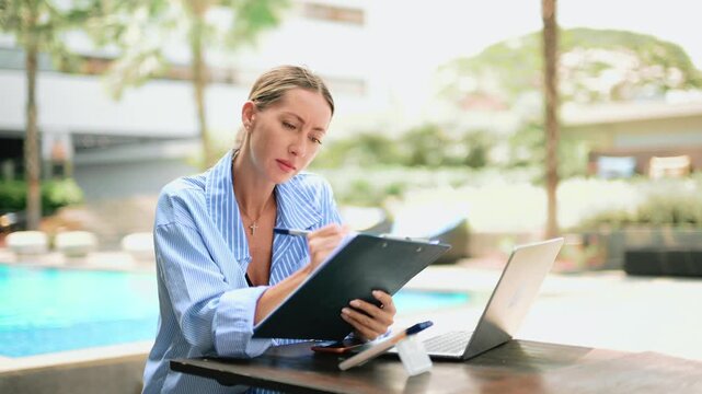 Stressed business woman working on laptop, talking on phone. Remote work pressure, deadline, burnout, anxiety, multitasking