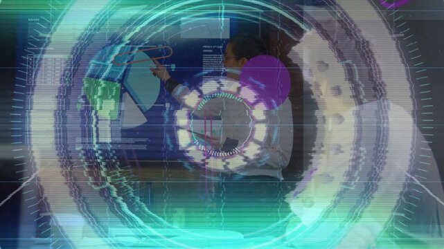 Female lead tapping tablet, pointing piechart in biz meeting, causing HUD overlay for feedback