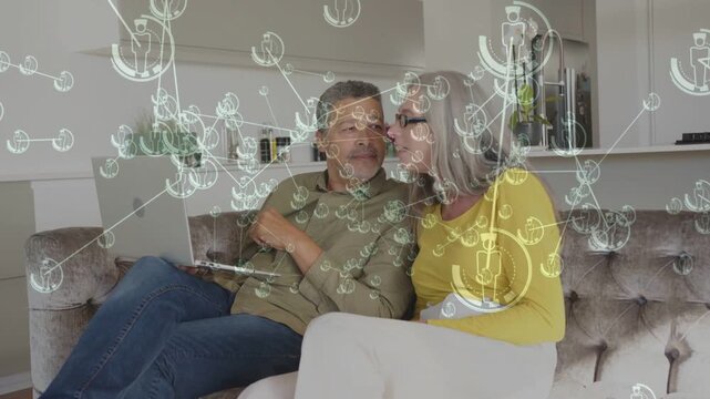 Man pointing laptop, woman leaning to share, switching to phone, tech overlay moving over subjects