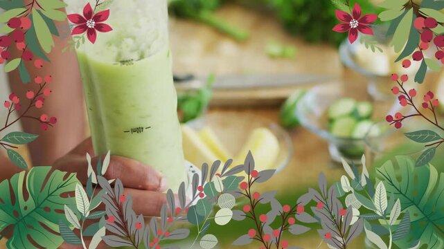 Cook hand pressing stick blender smoothing green puree for food with botanical overlay framing cup