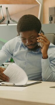 Business expert analyzes reports with focus and precision on screen
