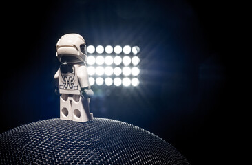 Naklejka premium Gothenburg, Sweden - October 04 2017: Miniature astronaut standing on textured sphere under bright lights.