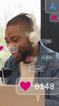 Vertical video: Streamer speaking into mic, likes rising, him leaning in and smiling for engagement