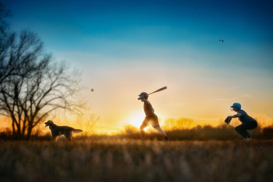 Kids Playing Baseball at Sunset