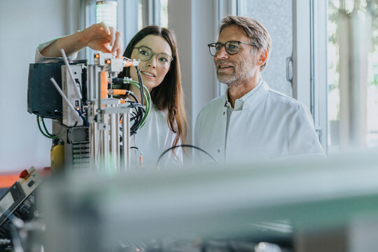 Scientist and researcher working with sorting machine in laboratory