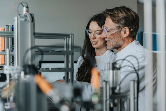 Scientist and researcher working at laboratory sorting machine