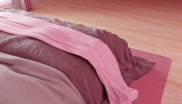 Close up of pink bed with soft blanket in minimalistic room