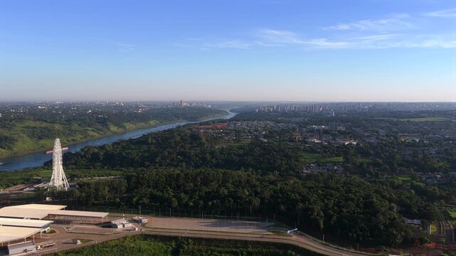 The Puente de la Integraci&oacute;n bridge links Paraguay and Brazil over a verdant landscape. Ideal for projects on international infrastructure or border crossings.