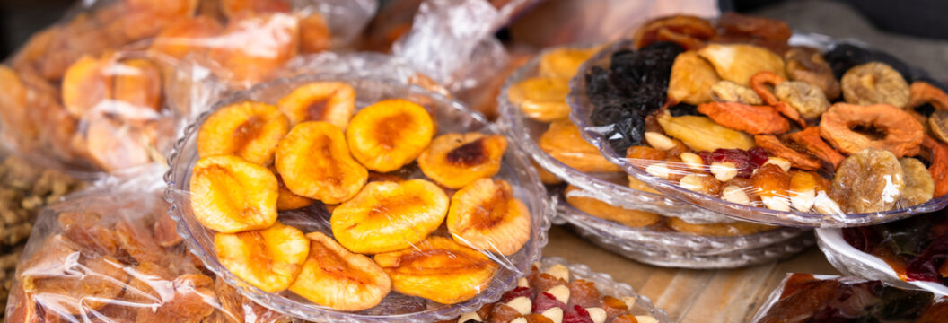 Assorted dried fruits arranged together, highlighting natural preservation, healthy snacking, vibrant colors, and the nutritional value of dehydrated produce.