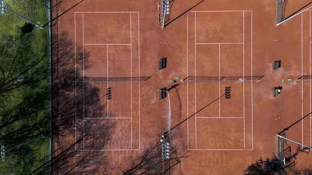 Aerial Top Down View of Clay Tennis Courts Maintenance, Camera Moving Forward