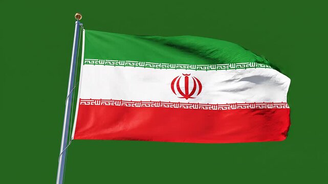 "National flag of Iran waving on flagpole with green, white, and red stripes and central red emblem"