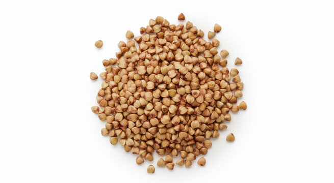 A small pile of raw buckwheat groats scattered on a clean white background, view, macro