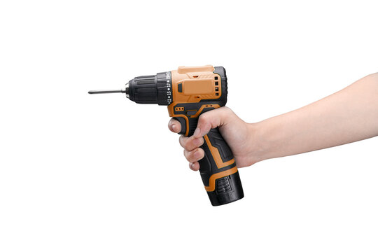 Person holding a portable orange and black cordless electric power drill and screwdriver tool isolated on a white background for home improvement construction and repair projects