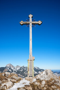 wooden mountain cross at Seeberg summit, view to Wendelstein mountain, bavaria