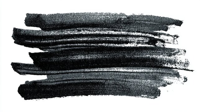 A close-up view of black paint strokes on a white background