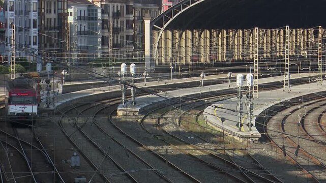 Urban train arriving at abando station in bilbao
