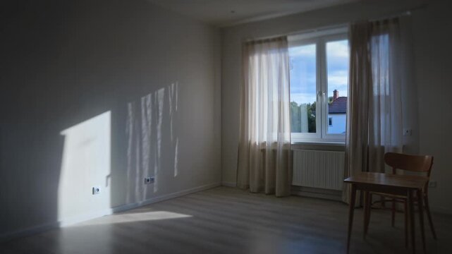 Empty room transitions from daylight to evening as sunlight fades across walls, creating a cinematic time passage scene ideal for real estate visuals, concept storytelling, or atmospheric advertising