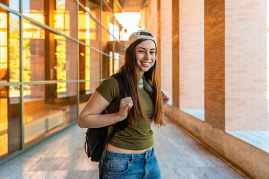 Young female student smiling on university campus