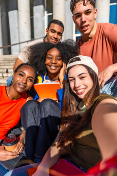 Diverse students taking a selfie on university campus