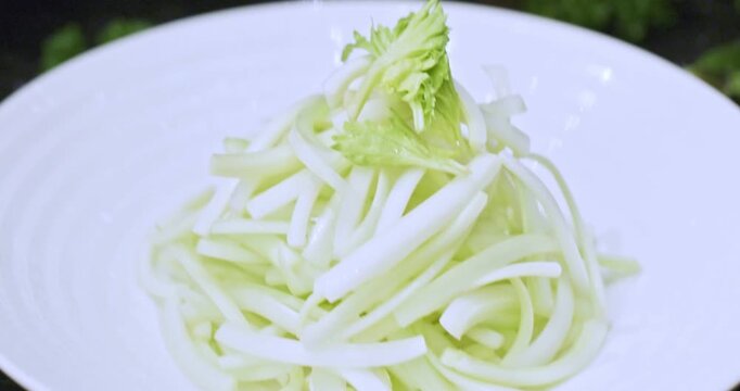 Delicious celery salad served on a white porcelain plate