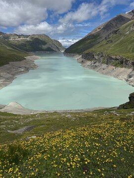 Lac des Dix alpine lake surrounded by rocky peaks on the Haute Route trail, Valais, Switzerland