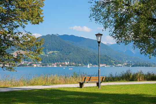 lakeside promenade Tegernsee Bad Wiessee, with bench and view to the castle, bavaria