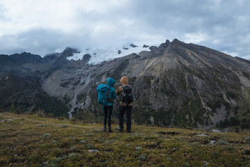 Fototapeta premium Backpackers hiking on high altitude mountain top