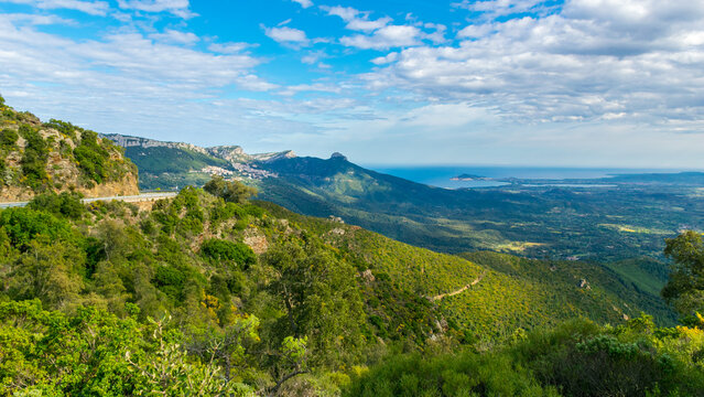Panoramic view from Gennargentu mountains to Tyrrhenian sea with Baunei village on left, Sardinia island, Italy