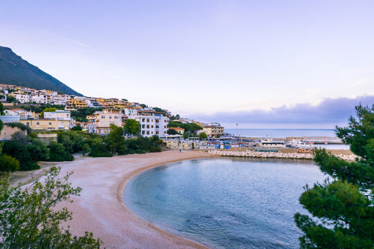 Panoramic evening view of sandy beach of Cala Gonone on Sardegna island, Italy