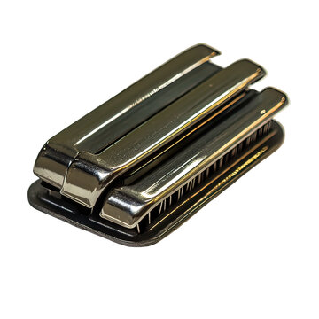 Closeup of a metal harmonica instrument.