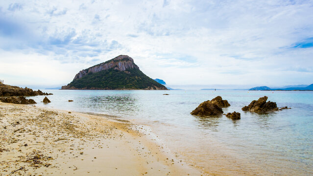 Morning panoramic view of Isola di Figarolo from Golfo Aranci beach on Sardinia Island, Italy