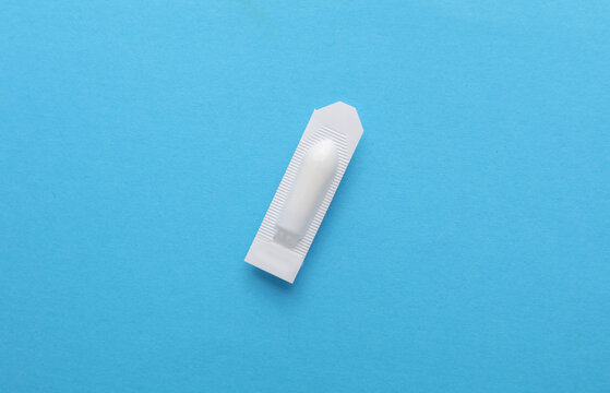 Rectal suppositories on a blue background