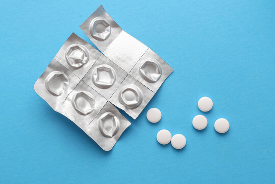 Blister with pills on blue background. Top view