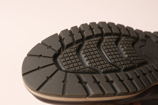 Tread sole of boots on a white background