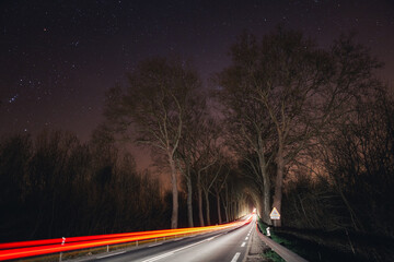 Night road with light trails under starry sky, Auxonne, France © Sébastien Joly