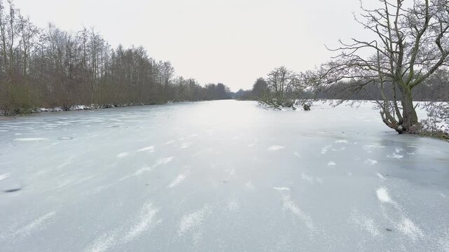 Ice skating in the Weerribben nature reserve personal point of view during a cold winter day in The Netherlands.