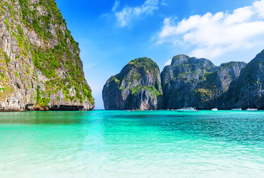 Empty Maya Bay Lagoon with Turquoise Water, Phi Phi islands in Thailand. Clean, minimal tropical seascape of Maya Bay with crystal-clear water and limestone cliffs