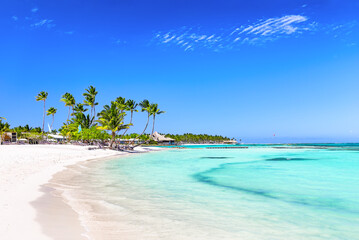 Beautiful white sand beach and turquoise water of Caribbean sea in Cap Cana, Dominican Republic. Summer beach holiday background © preto_perola