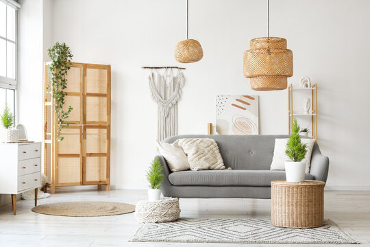Interior of living room with sofa, lamps and Cypress trees