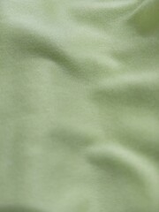 Obraz premium Soft Green Silk Fabric Texture Vertical Smooth Flowing Satin Background Minimal Elegant Surface