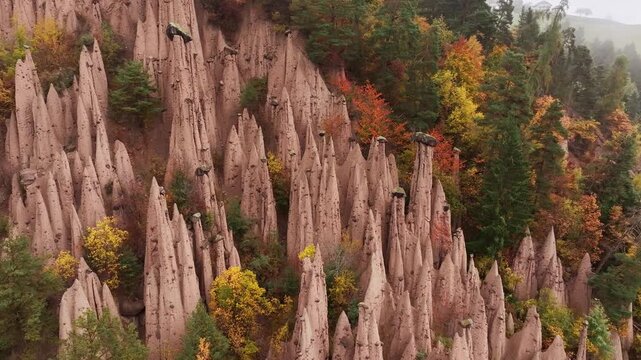 Earth pyramids of Platten at daytime, aerial view, at autumn season time.