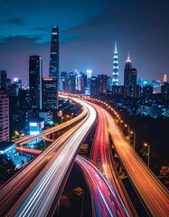 Fototapeta premium Cityscape at night with glowing traffic trails