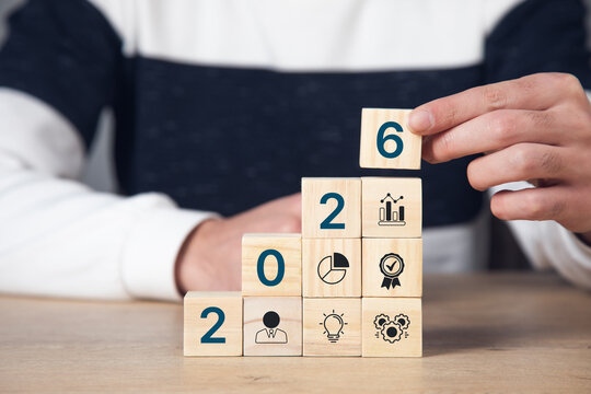 Businessman plan strategy marketing and finance to goal in 2026 planning business growth with technology AI and environmental care to New Year resolutions business.