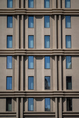 Obraz premium Plain facade with narrow vertical windows, Palermo, Sicily, Italy