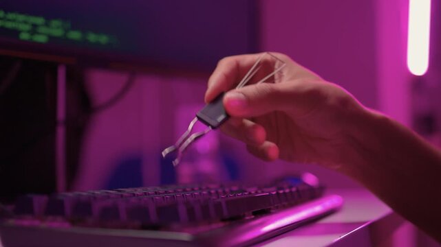 Removing and replacing keyboard keycaps. Detailed view of keycap swapping on keyboard. Vivid scene demonstrating removal and installation of keycaps on mechanical keyboard